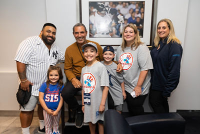 The Gomez Family with Lee Mazzilli (former Yankee Player), and Sophia Agoritsas from Cohen Children’™s Medical Center