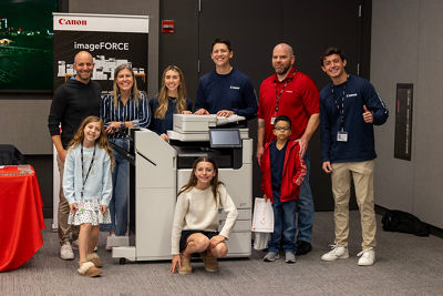 Employees with family at the 2025 Canon Family Photo Day.