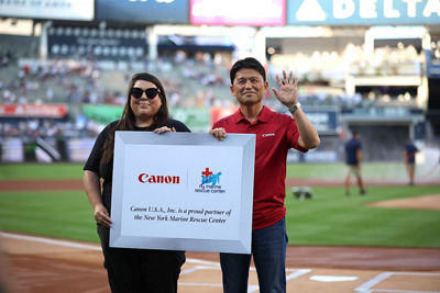 Canon U.S.A. CEO Sammy Kobayashi & NY Marine Rescue Center’s Maxine Montello take part in a pre-game ceremony on the field.