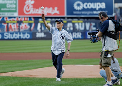 Canon U.S.A. Executive VP Seymour Liebman throws out a ceremonial first pitch at the Yankees game.