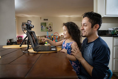 Daughter and father on the computer using Webcam Utility
