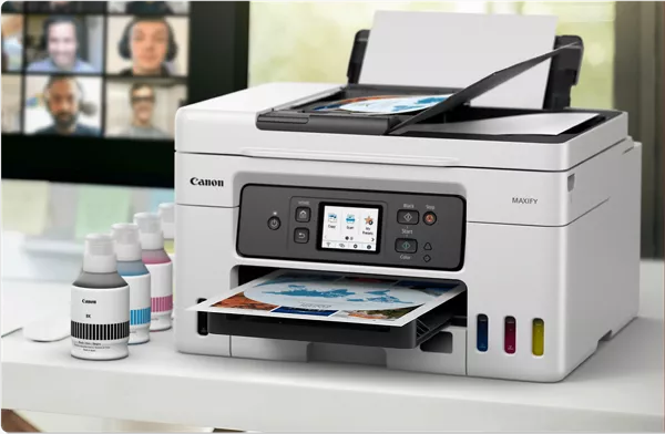MAXIFY GX4020 - Imprimante à côté des bouteilles d’encre