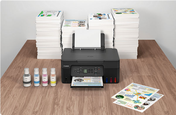 PIXMA G3270 - Front View in Front of Many Stacks of Printed Flyers