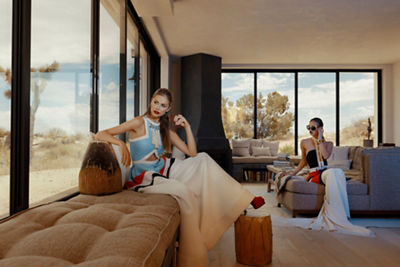 two women models sitting in living room