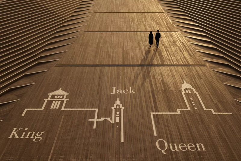 Two People Walking Away From Street art 