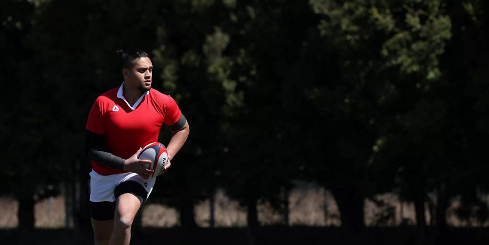 Joueur de rugby qui court