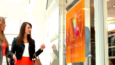 Woman looking at PANTONE printed poster