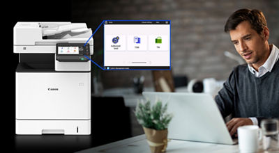 Person on a Laptop with the imageCLASS X MF1538C II on the Left Side