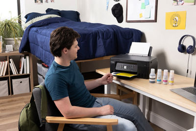 Person Using Canon Printer