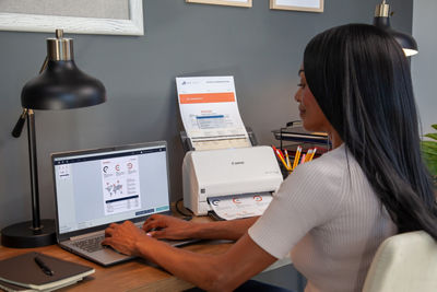 Person Using Canon Scanner