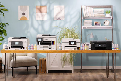 4 Different Canon Printers on a Wooden Table
