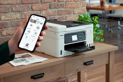 Person Using Mobile Device to Print