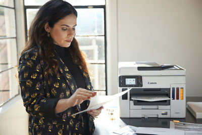 Person Using Canon Printer