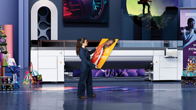 Woman holding poster in front of the colorado