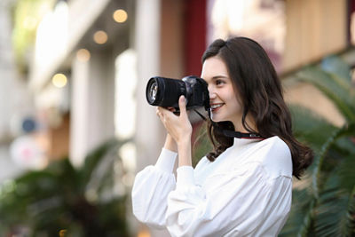 girl holding camera