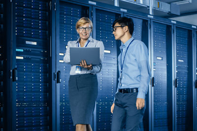 Man and a Woman working in a data center