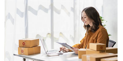 Woman working on computer at desk.