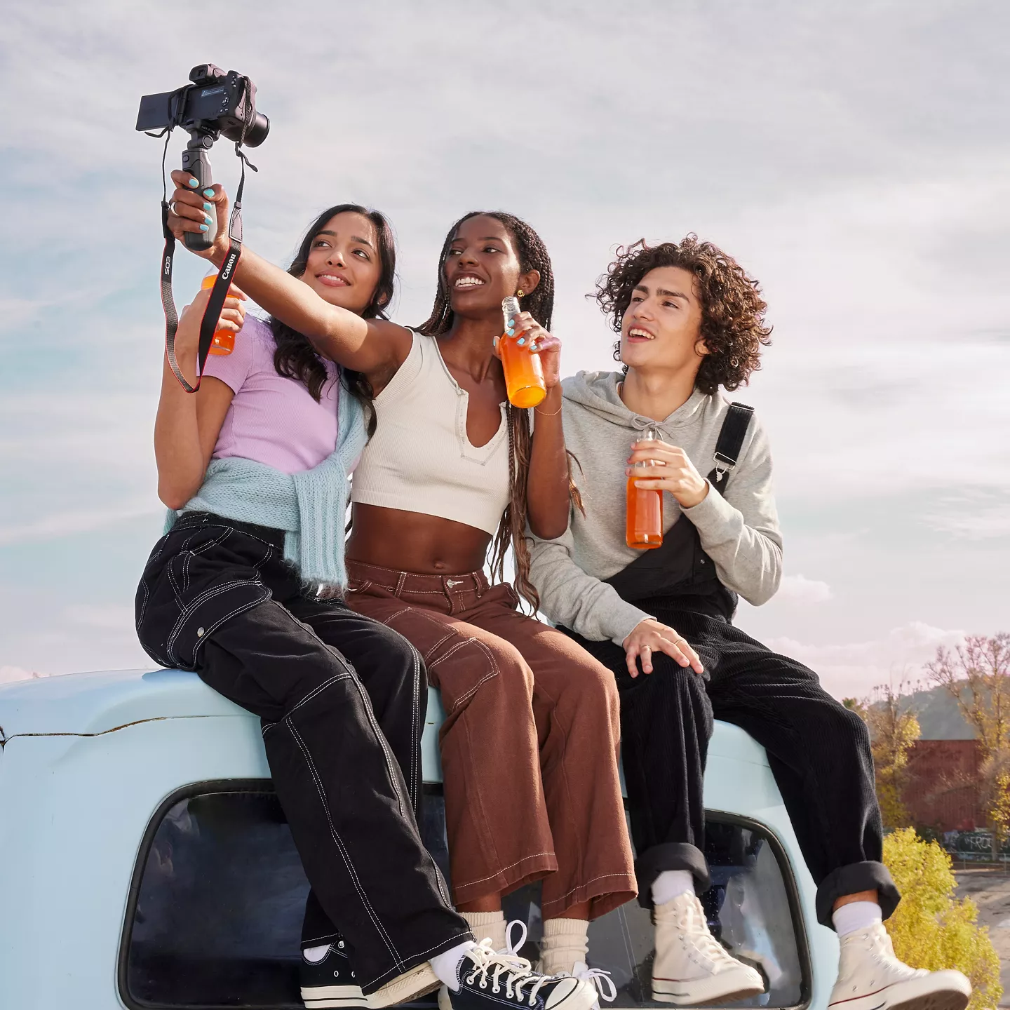 Friends Taking a Picture with the EOS R50
