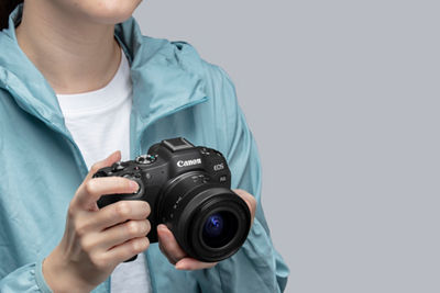 Person Holding EOS R8