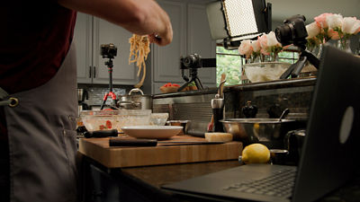 Person Cooking while using a Camera with EOS Webcam Utility