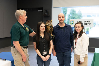 Canon U.S.A. employees enjoyed meeting and learning about Sweetbriar Nature Center's resident owls