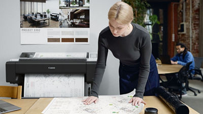 woman working with the imagePROGRAF TM-610M