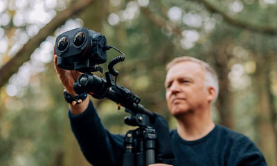 Man using EOS VR camera and lens