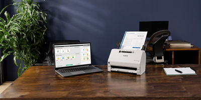 imageFORMULA R40 on a Desk Next to a Laptop