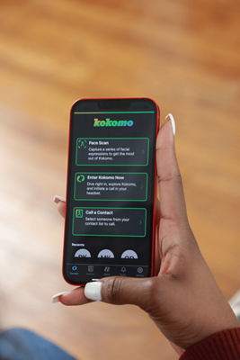 Person Holding Smart Phone with Kokomo App Open