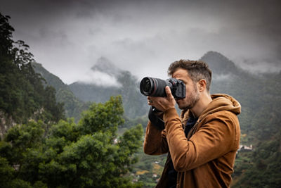 Photographer holding EOS R5 C