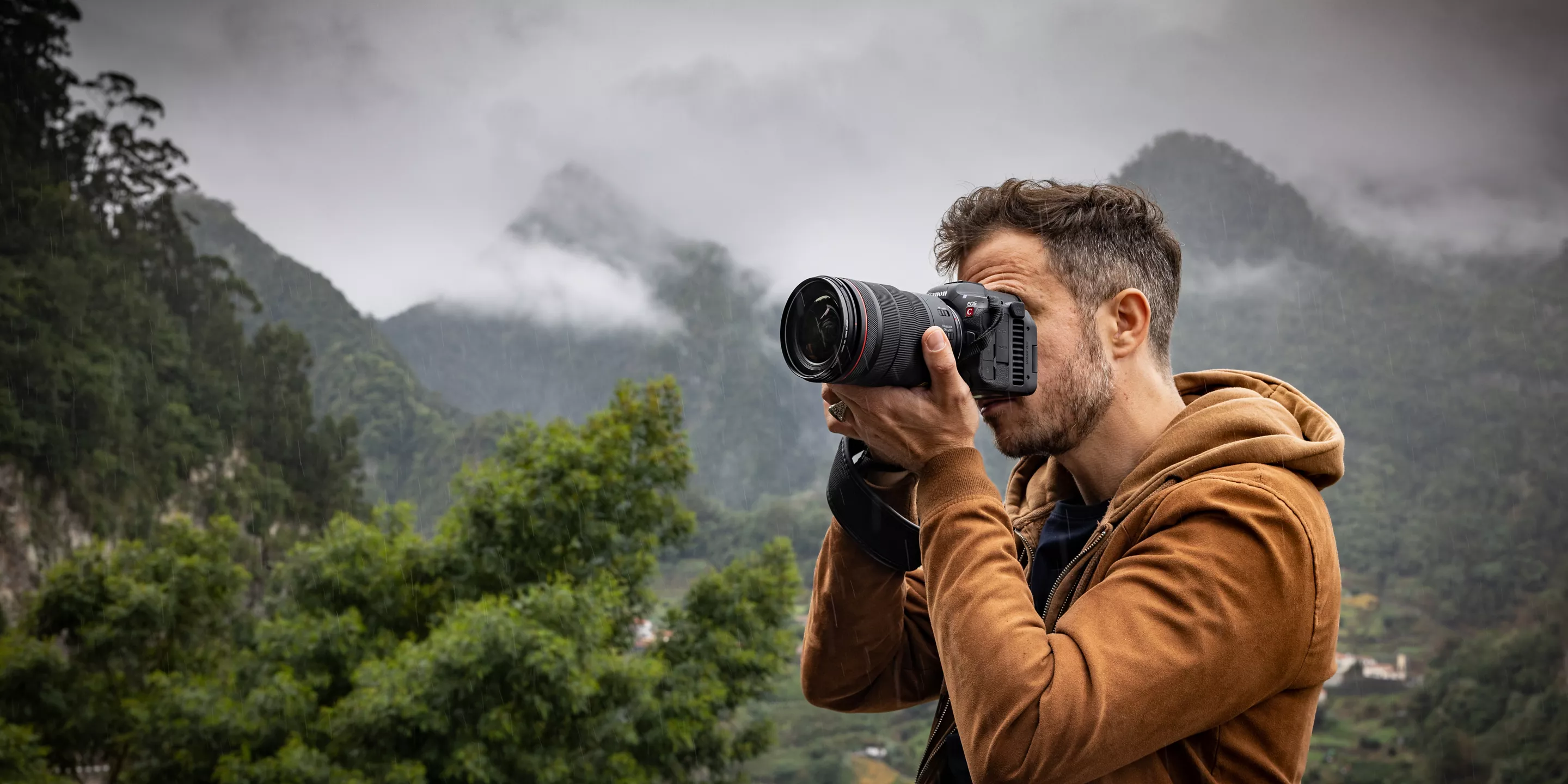 Photographer holding EOS R5 C