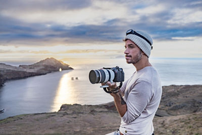 Photograher holding EOS R5 C