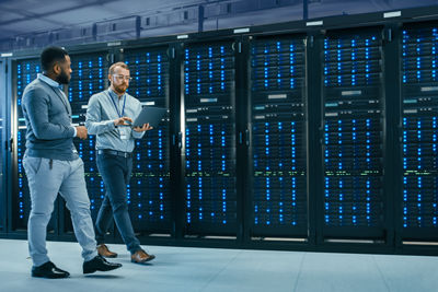 two men working in a data center
