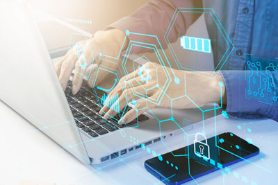 Hands working on a computer keyboard