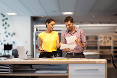 man and woman working in an office