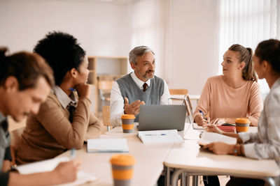 Men and women working in a conference Room