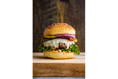 still life image of a cheeseburger