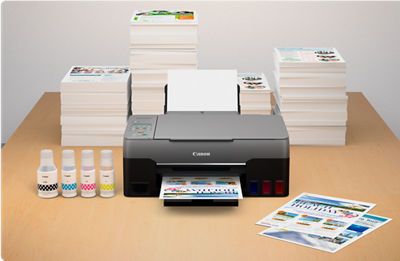 PIXMA G3262 - Front View in Front of Many Stacks of Printed Flyers