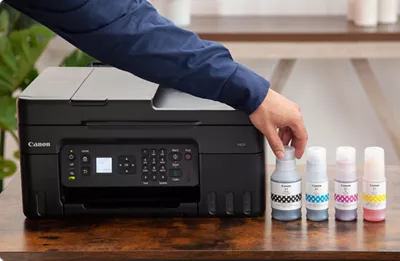 PIXMA G4270 - Printer next to Ink Bottles
