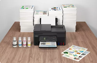 PIXMA G4270 - Front View in Front of Many Stacks of Printed Flyers