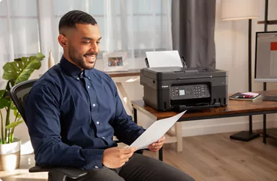 PIXMA G4270 - Person Holding Printed Paper
