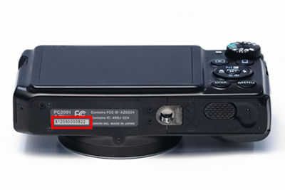 How to find the serial number location on a Canon PowerShot Digital Camera