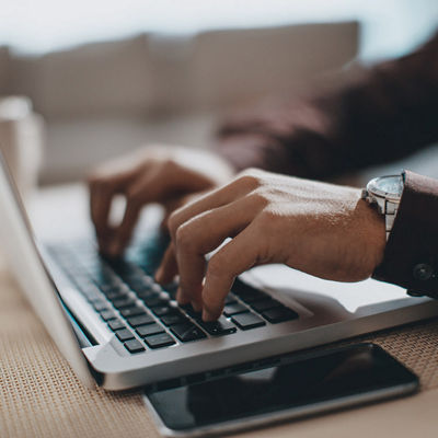 Image of a hands working on a computer