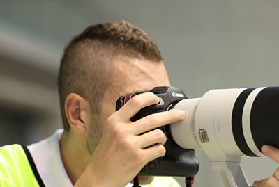 Person Taking a Picture Using Focus Preset Button