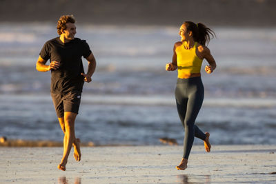 Couple jogging on a beach