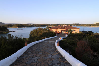 Stone Road Leading to House Near a Lake