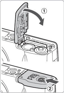 Installing the batteries and memory card into a PowerShot SX120 IS