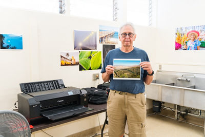 Veteran holding an image of printed field