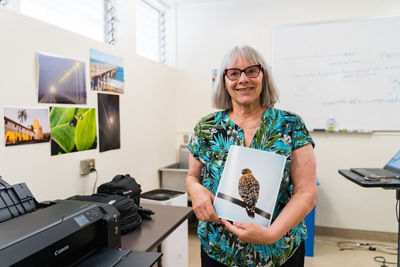 Veteran holding an image of printed bird