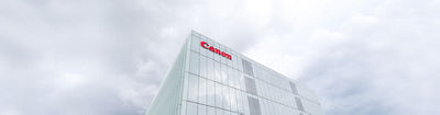 Image of an office building with Canon on it